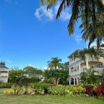 A romantic resort in Barbados with palm trees and a lush garden